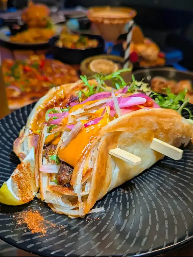 Parotha tacos with pickled onion and fresh salad