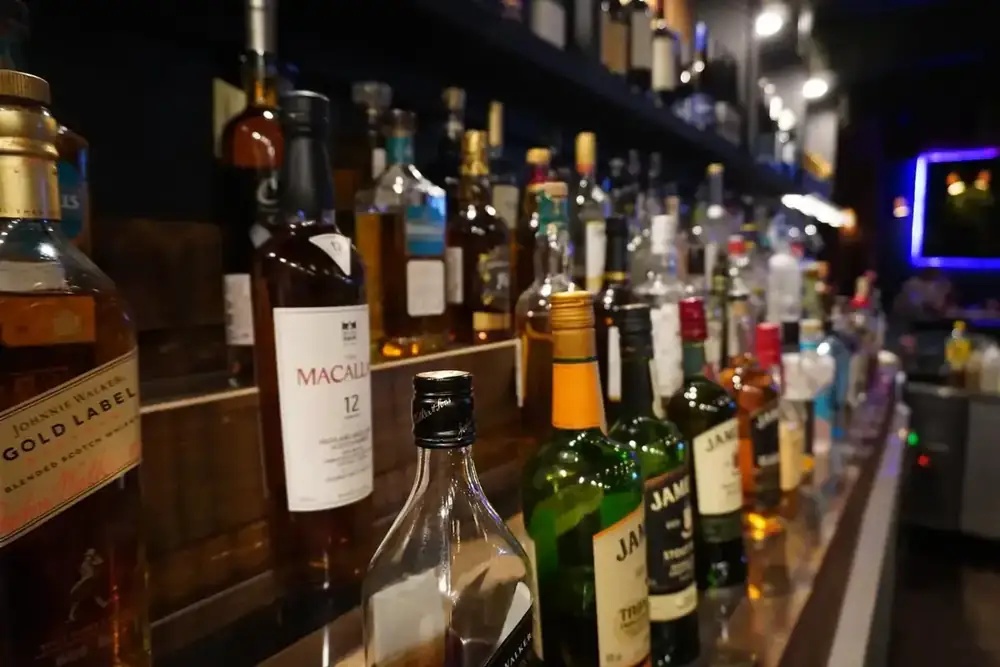Spirit bottles lined up along the back bar