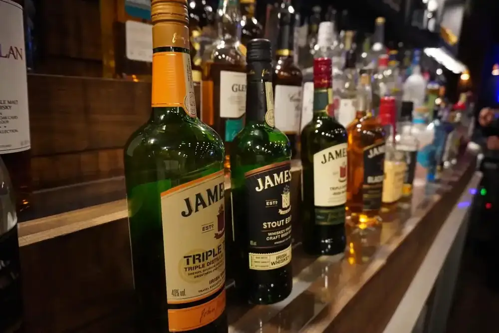 Whisky bottles on the bar shelf