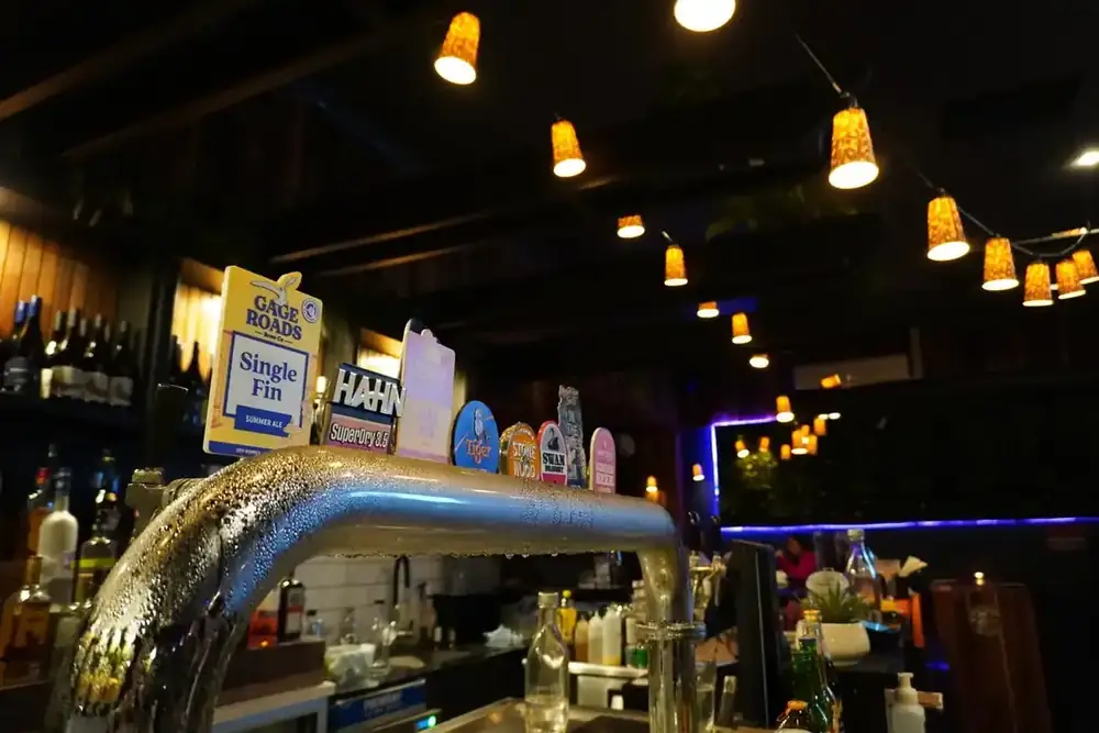 The bar taps with the dining room behind