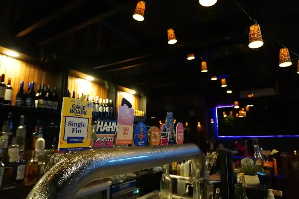 Beer taps and spirit bottles at the bar