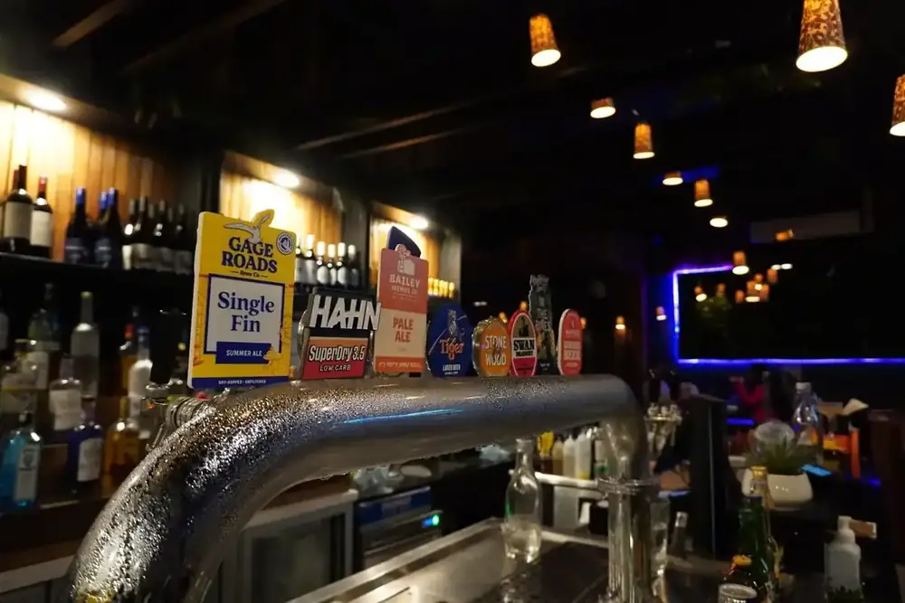 A close view of the beer taps at the bar