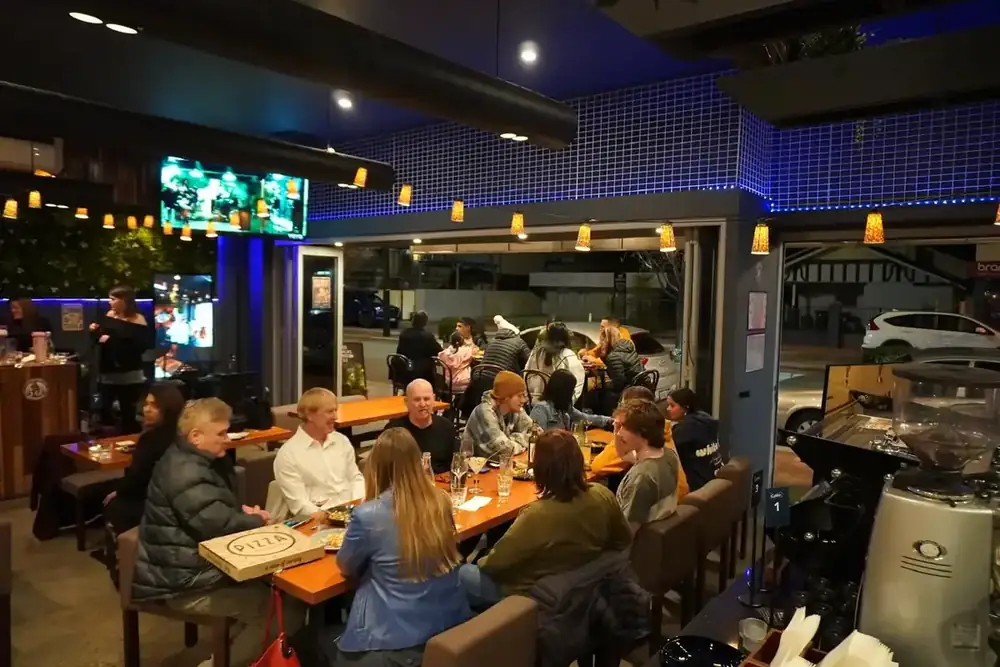 The dining room busy with guests at night